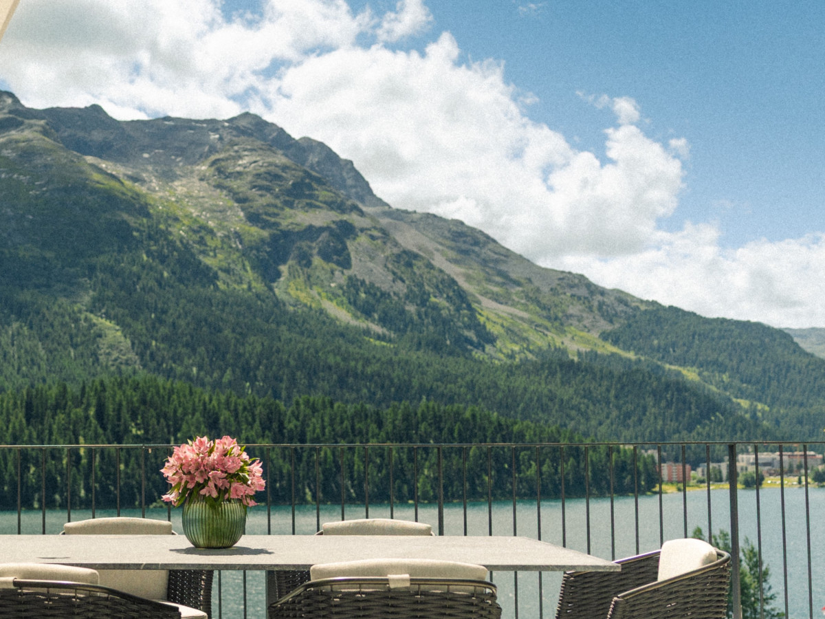 Summer view of the mountains with a lake panorama.